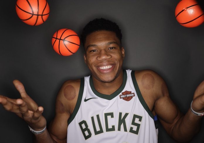 giannis-antetokounmpo-signs-with-nike-696x489.jpg